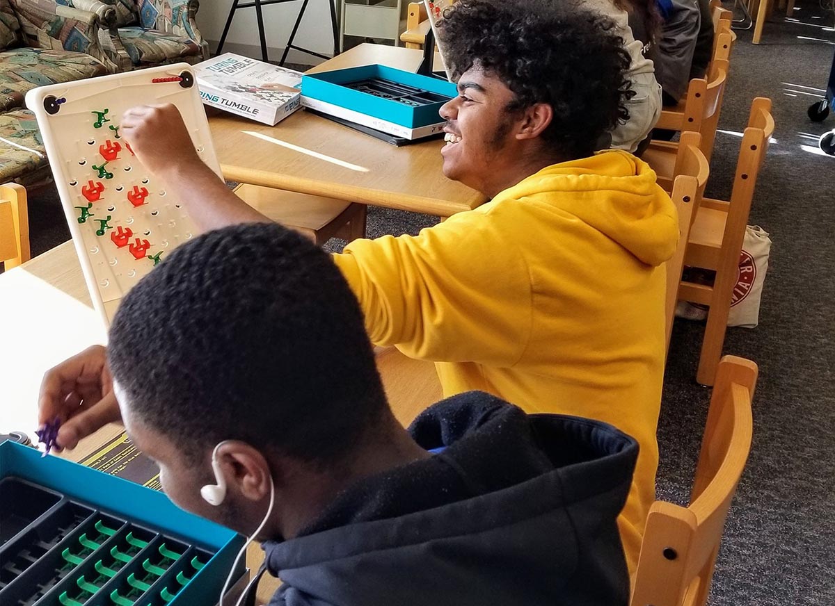 college students in classroom playing Turing Tumble