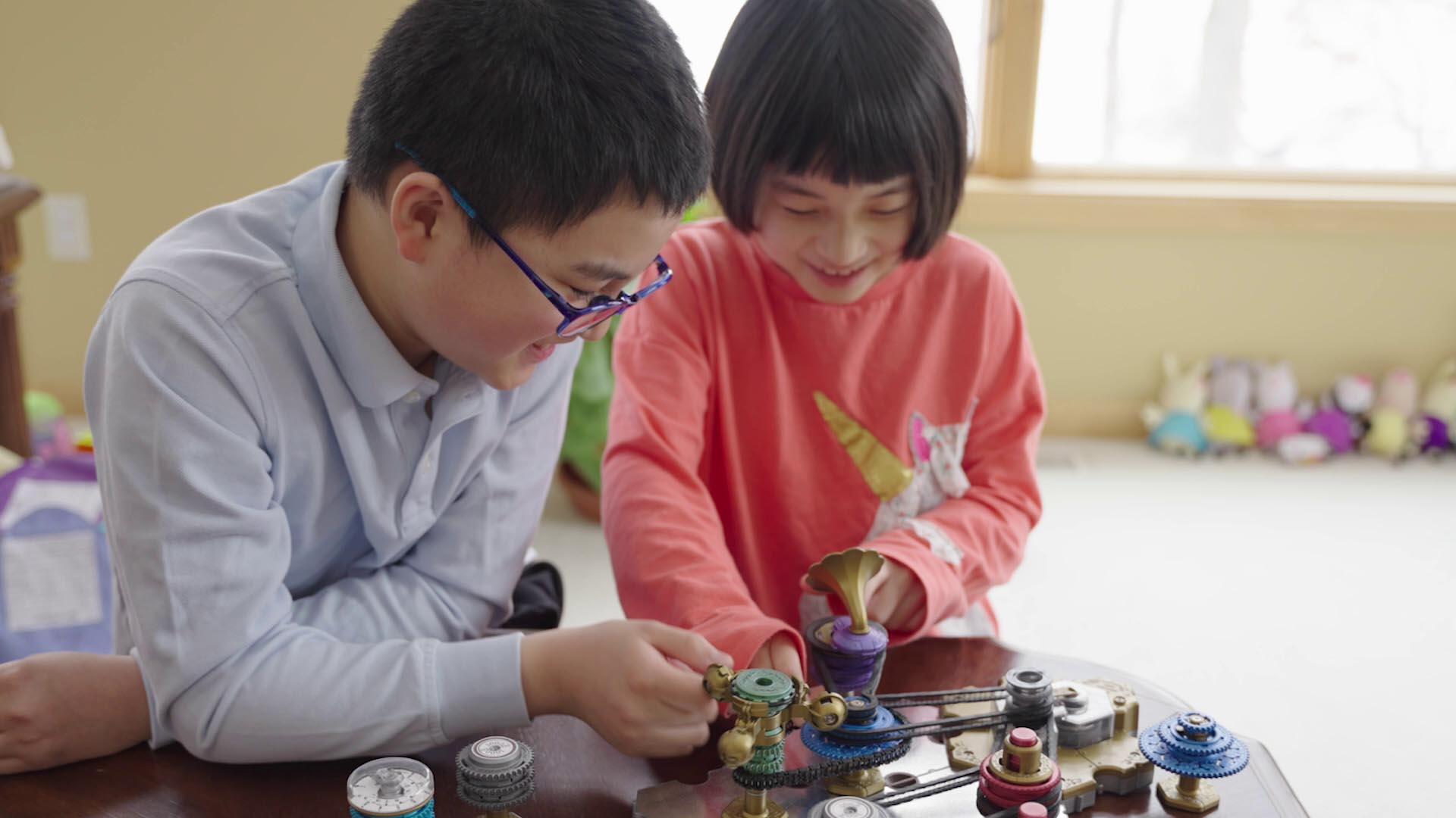 sister and brother playing Spintronics